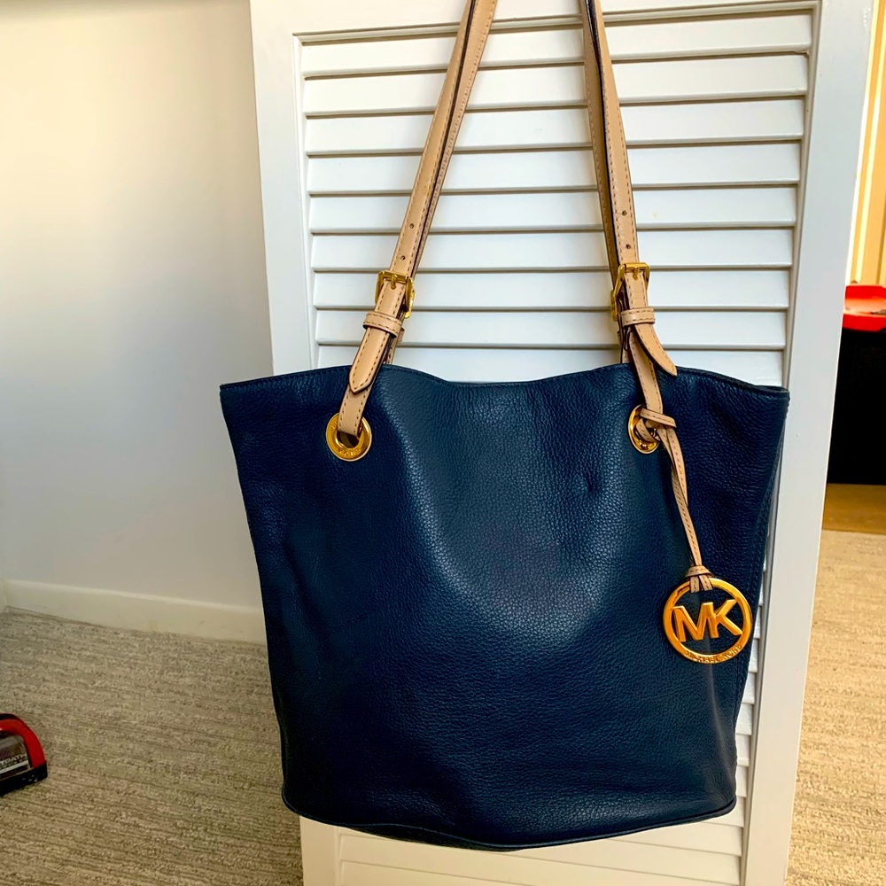 Navy blue and cream soft leather bucket style bag. Authentic Michael Kors.
